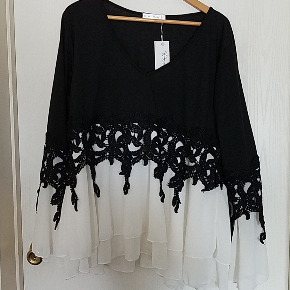 Black and white lace adorned top.